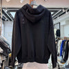 A woolen hoodie is loose